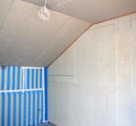 Schlafzimmer mit Fermacell-Wand zur Ankleide